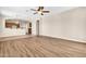 Open-concept living room featuring wood flooring and an open view to the kitchen at 209 E Diamond Trl, San Tan Valley, AZ 85143