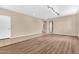 Living room features wood and tile flooring with access to the bedrooms at 209 E Diamond Trl, San Tan Valley, AZ 85143