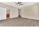 Main bedroom with wood floors and access to the ensuite bathroom at 209 E Diamond Trl, San Tan Valley, AZ 85143