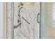 Bathroom shower stall featuring marble-look surround, grab bars and adjustable shower head at 209 E Diamond Trl, San Tan Valley, AZ 85143