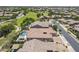 Bird's eye view showcases this property's landscaped yard, sparkling pool, and outdoor entertaining areas at 22255 E Quintero Rd, Queen Creek, AZ 85142