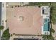 Aerial view of a single-Gathering home showcasing the tiled roof, courtyard, outdoor pool, and paved backyard at 22255 E Quintero Rd, Queen Creek, AZ 85142
