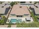 Aerial view of home showing the tile roof, manicured lawn, pool, outdoor gazebo, and paved backyard at 22255 E Quintero Rd, Queen Creek, AZ 85142