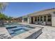 Beautiful backyard featuring a pool, spa, covered patio, and outdoor seating area at 22255 E Quintero Rd, Queen Creek, AZ 85142