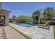 Lush backyard with pool, spa, covered patio, and lounge chairs at 22255 E Quintero Rd, Queen Creek, AZ 85142
