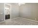 Cozy bedroom with plush carpeting, neutral tones, a ceiling fan, and a convenient ensuite bathroom at 22255 E Quintero Rd, Queen Creek, AZ 85142