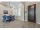 Bright dining room featuring wood-look tile flooring, a modern ceiling fan, and large windows at 22255 E Quintero Rd, Queen Creek, AZ 85142