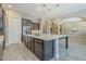 Modern kitchen with a center island, stainless steel appliances, and an open layout at 22255 E Quintero Rd, Queen Creek, AZ 85142