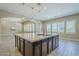 Spacious kitchen with island, stainless appliances, and large windows at 22255 E Quintero Rd, Queen Creek, AZ 85142