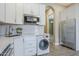 Modern kitchen featuring stainless steel appliances, white cabinetry, and light countertops for a sleek, efficient design at 22255 E Quintero Rd, Queen Creek, AZ 85142