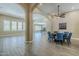 Open-concept living space featuring wood-look tile flooring, elegant archways, and recessed lighting at 22255 E Quintero Rd, Queen Creek, AZ 85142