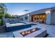 Beautiful pool and spa area with fire pit and covered patio at 22255 E Quintero Rd, Queen Creek, AZ 85142