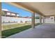 Spacious backyard featuring a well-maintained lawn, a fire pit, and covered patio, great for relaxing and entertaining at 22341 N 100Th Ln, Peoria, AZ 85383