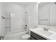 Bathroom featuring a tub, sink, toilet and framed mirror at 22341 N 100Th Ln, Peoria, AZ 85383