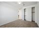 A bright bedroom with carpet, a closet with sliding doors and ceiling fan at 22341 N 100Th Ln, Peoria, AZ 85383