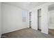 A bright bedroom with carpet, a window, and a closet with sliding doors at 22341 N 100Th Ln, Peoria, AZ 85383