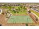 A community park with a playground and basketball court, surrounded by homes and beautiful landscaping at 22341 N 100Th Ln, Peoria, AZ 85383