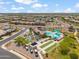 Overhead shot of a neighborhood park with a pool, bocce ball court, playground and shaded picnic areas at 22341 N 100Th Ln, Peoria, AZ 85383