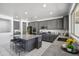 Stylish kitchen showcasing gray cabinetry, a speckled granite island, and stainless steel appliances at 22341 N 100Th Ln, Peoria, AZ 85383