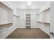 Spacious walk-in closet with shelving and hanging rods at 22341 N 100Th Ln, Peoria, AZ 85383