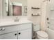 Clean bathroom featuring a bright vanity with framed mirror, shower-tub combo, and neutral walls at 2256 W Laurie Ln, Phoenix, AZ 85021