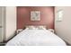 Bright bedroom with a queen bed, matching bedside tables, neutral walls, and a calming artwork piece at 2256 W Laurie Ln, Phoenix, AZ 85021
