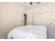 Comfortable bedroom featuring a queen bed, sliding closet doors, and neutral walls at 2256 W Laurie Ln, Phoenix, AZ 85021