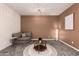 Comfortable living room with modern lighting, and plush seating, creating a relaxing atmosphere for gatherings at 2256 W Laurie Ln, Phoenix, AZ 85021