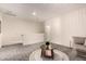Spacious living room boasts natural light, with plush seating, and modern lighting at 2256 W Laurie Ln, Phoenix, AZ 85021