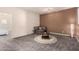 Cozy living room with neutral color scheme, plush seating, and modern lighting, perfect for relaxation and entertainment at 2256 W Laurie Ln, Phoenix, AZ 85021
