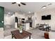 Open-concept living space with a kitchen, dining area, and comfortable seating arrangement at 2256 W Laurie Ln, Phoenix, AZ 85021