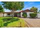 Charming single-story home with a well-maintained lawn and beautiful mature shade tree at 2264 S Don Carlos --, Mesa, AZ 85202