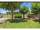 Lush backyard featuring mature trees, a gazebo, and ample green space, perfect for outdoor activities and relaxation at 2264 S Don Carlos --, Mesa, AZ 85202