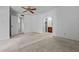 Spacious bedroom with ceiling fan and view to vanity and entry hallway at 2264 S Don Carlos --, Mesa, AZ 85202