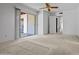 Bedroom with ceiling fan and sliding glass door with outdoor access at 2264 S Don Carlos --, Mesa, AZ 85202