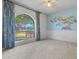 Bedroom with light-colored carpet and unique art on the wall at 2264 S Don Carlos --, Mesa, AZ 85202