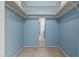 Closet features built in shelving and blue colored walls at 2264 S Don Carlos --, Mesa, AZ 85202