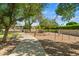 Serene community park with paved path, seating and outdoor fitness equipment amidst lush trees and landscaping at 2264 S Don Carlos --, Mesa, AZ 85202