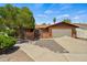 Charming single-story brick home featuring a tile roof and well-manicured front yard at 2264 S Don Carlos --, Mesa, AZ 85202