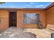 Charming brick home featuring a welcoming front entrance and a large window for plenty of natural light at 2264 S Don Carlos --, Mesa, AZ 85202