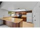 Bright kitchen featuring wood cabinets, light countertops, and ample storage at 2264 S Don Carlos --, Mesa, AZ 85202
