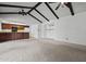 Open living room concept with beamed ceilings and seamless access to the kitchen at 2264 S Don Carlos --, Mesa, AZ 85202