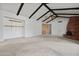 Spacious living room has beamed ceilings, fireplace, and neutral carpet at 2264 S Don Carlos --, Mesa, AZ 85202