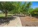 Scenic park pathway lined with mature trees and exercise equipment, perfect for walking, jogging, and outdoor fitness at 2264 S Don Carlos --, Mesa, AZ 85202