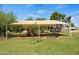 Covered playground with slides and benches offering a fun, shaded area for children to play and enjoy outdoor recreation at 2264 S Don Carlos --, Mesa, AZ 85202