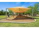Large sunshade covers playground equipment including slides, swings and a climbing structure at 2264 S Don Carlos --, Mesa, AZ 85202