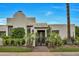 Stunning home featuring an ornamental gate, lush landscaping, and a meticulously manicured lawn at 3109 E Sierra Madre Way, Phoenix, AZ 85016