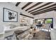 Inviting living room featuring exposed wood beams, stylish decor, and an open floor plan at 3109 E Sierra Madre Way, Phoenix, AZ 85016
