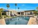 Resort-style backyard featuring a sparkling pool, lush greenery, and comfortable lounge seating for ultimate relaxation at 3109 E Sierra Madre Way, Phoenix, AZ 85016