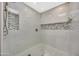 Elegant shower showcasing marble tile, mosaic accents, and modern fixtures at 3109 E Sierra Madre Way, Phoenix, AZ 85016